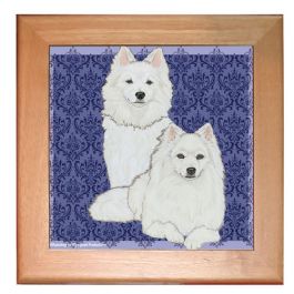 An image of product 13001 American Eskimo Eskie Dog Kitchen Ceramic Trivet Framed in Pine 8" x 8"